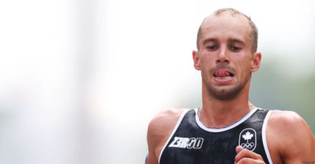 Olympic athlete violently vomits on live television after swimming in polluted Seine river
