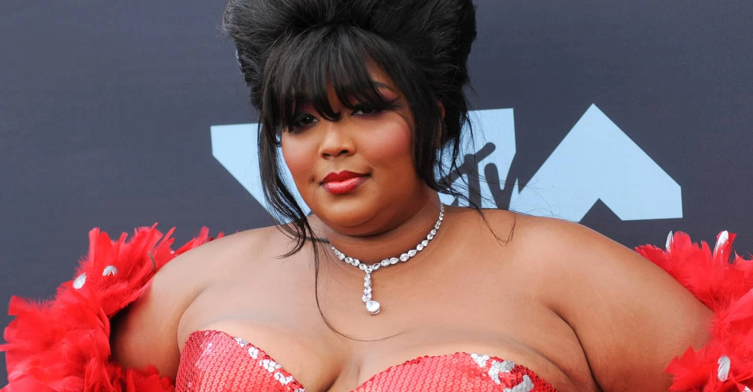 Lizzo breaks down in tears as she calls out 'fatphobic' and 'racist' abuse after new music video debut