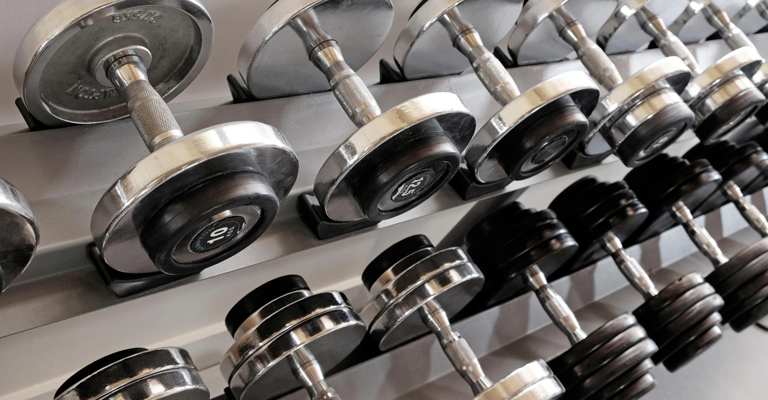 Woman forced to call 911 after getting stuck upside down in gym equipment