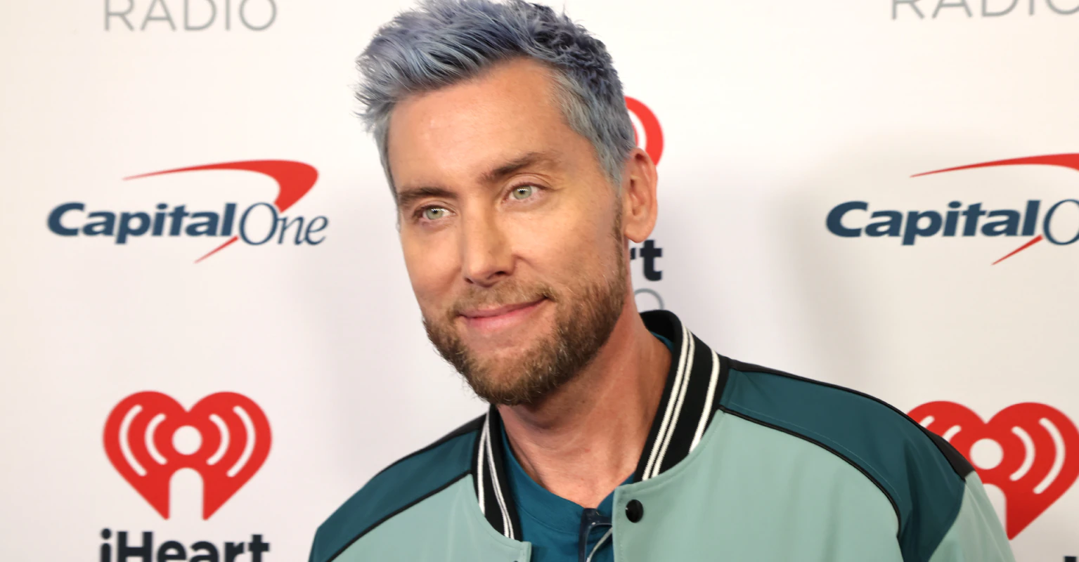 NSYNC's Lance Bass trolls the NFL with 'not Taylor Swift' sign during game
